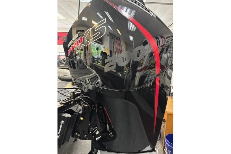 Slide: The Image of 2026 Ranger Z518 boat with Mercury Pro XS 200 engine in showroom. - 11