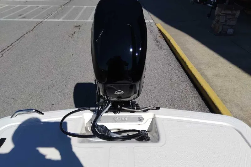 Slide: The Image of 2026 Mako Pro Skiff 15 CC boat engine, parked on pavement. - 61