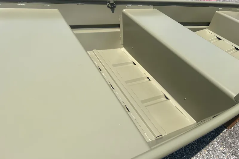 Slide: The Image of 2026 Tracker Grizzly 10 Jon boat interior with bench seating and flat flooring. - 8