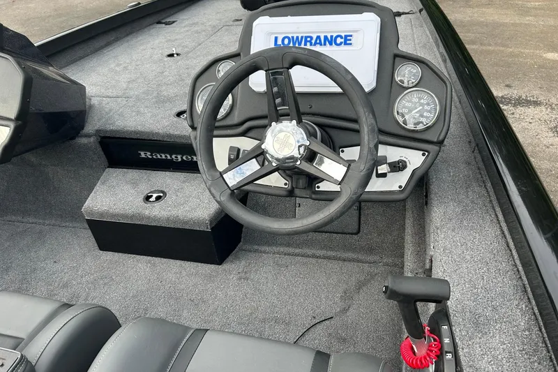 Slide: The Image of 2026 Ranger RT198P boat dashboard with steering wheel and Lowrance display. - 4