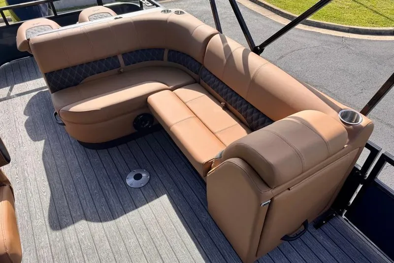 Slide: The Image of Luxurious seating on 2026 Ranger 223FC boat with tan upholstery and cup holders. - 14