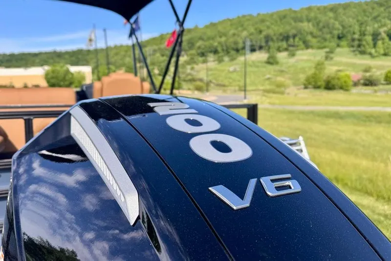 Slide: The Image of Close-up of a 2026 Ranger 223FC V6 engine in a scenic outdoor setting. - 16