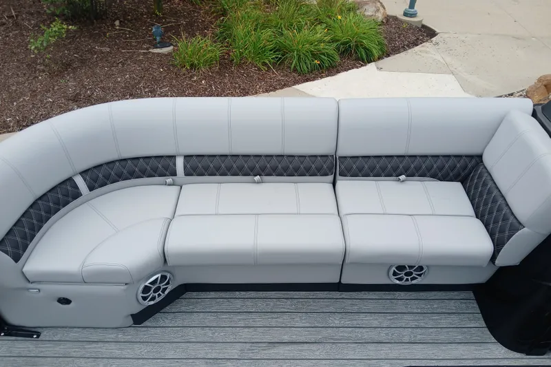Slide: The Image of Luxurious seating on 2026 Ranger 223FC boat with gray upholstery and diamond-patterned accents. - 3