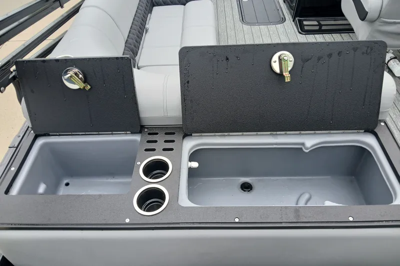 Slide: The Image of 2026 Ranger 223FC boat interior with storage compartments and cup holders. - 7