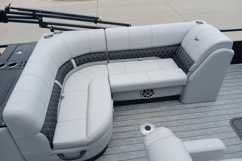 Slide: The Image of Luxurious seating on 2026 Ranger 223FC boat with gray upholstery and cup holders. - 5