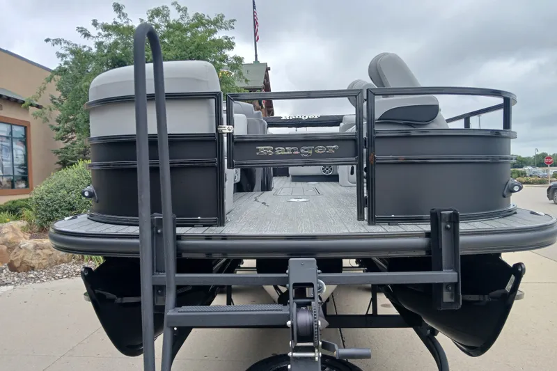 Slide: The Image of 2026 Ranger 223FC pontoon boat, rear view, showcasing sleek design and spacious seating. - 1