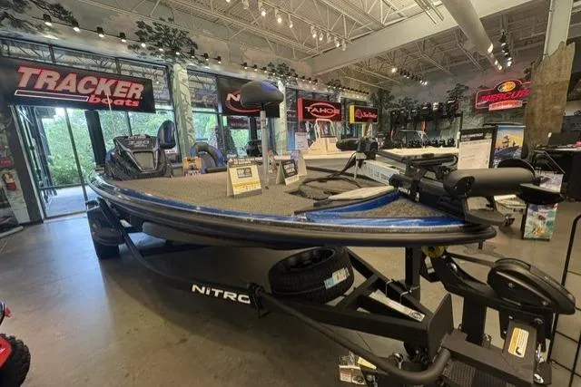 Slide: The Image of 2026 Nitro Z20 XL Pro boat displayed in a showroom with various marine equipment. - 3