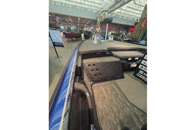 Slide: The Image of 2026 Nitro Z20 XL Pro boat interior at a showroom, showcasing deck and storage features. - 1