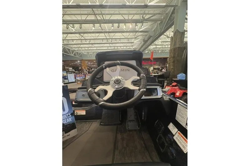 Slide: The Image of Steering wheel of 2026 Nitro Z20 XL Pro boat with Garmin display in showroom. - 4