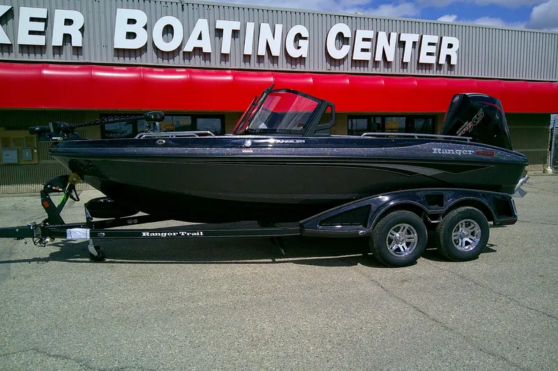 The Image of 2026 Ranger 1880MS boat on trailer outside a boating center. - 0