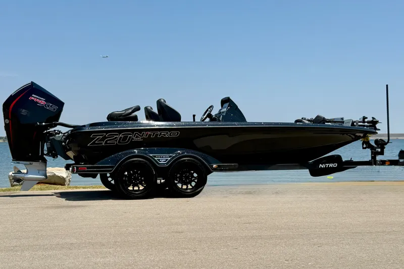 Slide: The Image of 2026 Nitro Z20 XL Pro boat on trailer by the water. - 15