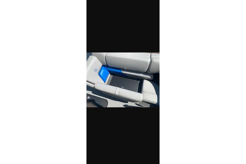 Slide: The Image of 2026 Sun Tracker Party Barge 22 XP3 interior seating with storage compartment. - 33
