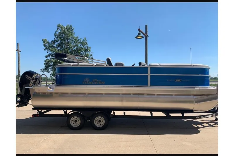 The Image of 2026 Sun Tracker Party Barge 22 XP3 pontoon boat on trailer, side view. - 0