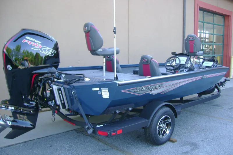 Slide: The Image of 2026 Ranger RT188P fishing boat with Mercury Pro XS engine, parked on a trailer. - 2