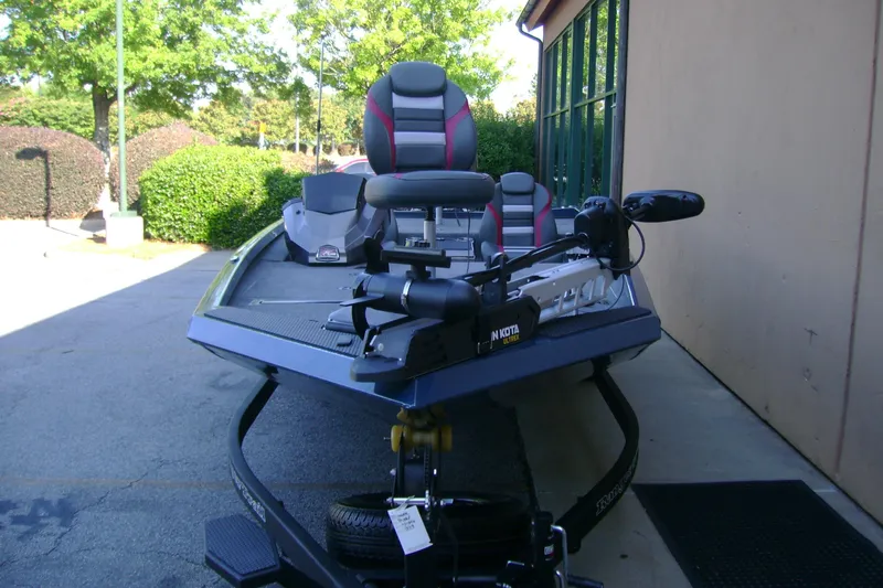 Slide: The Image of 2026 Ranger RT188P fishing boat with Minn Kota trolling motor, parked outdoors. - 3