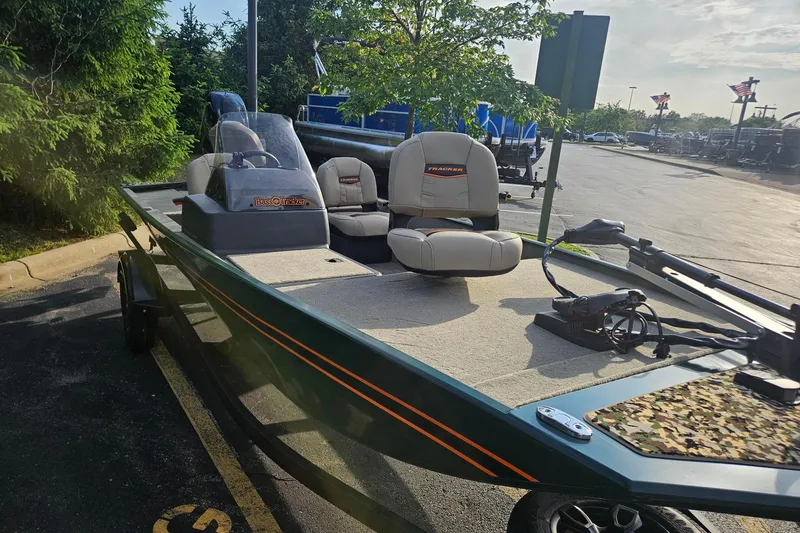 Slide: The Image of 2026 Tracker Bass Tracker Classic Limited boat parked outdoors, featuring comfortable seating and modern design. - 44