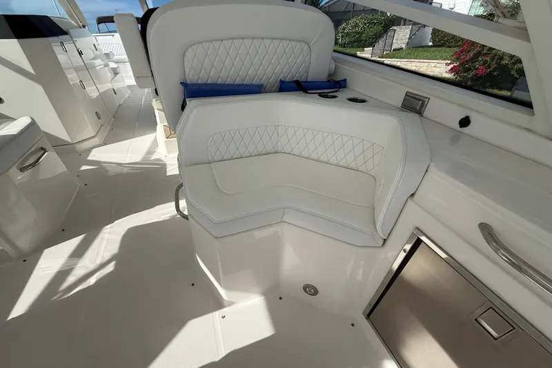 Slide: The Image of Luxurious seating on 2021 World Cat 400 DC-X boat, featuring diamond-stitched upholstery. - 16