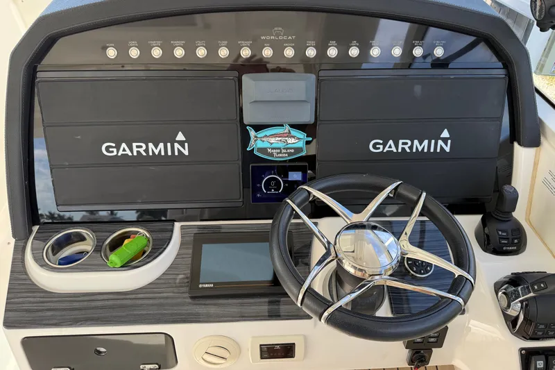 Slide: The Image of Dashboard of 2021 World Cat 400 DC-X with Garmin displays and steering wheel. - 32