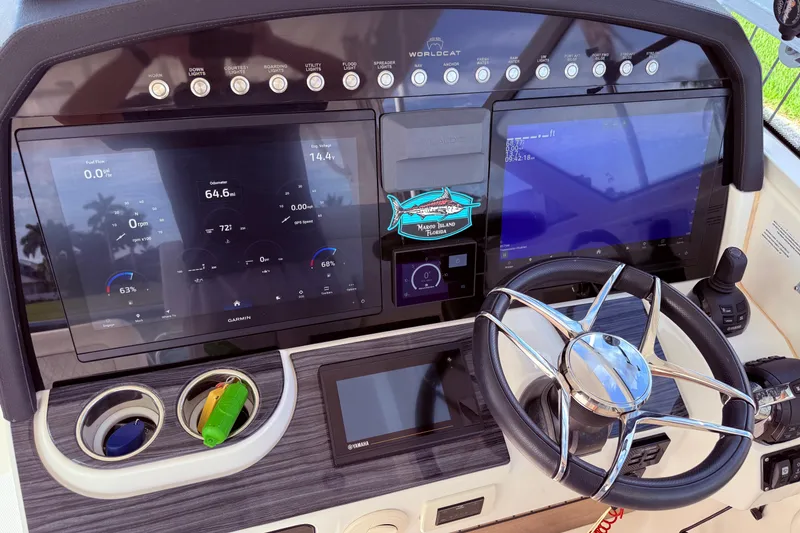 Slide: The Image of Dashboard of 2021 World Cat 400 DC-X boat with advanced navigation displays. - 33