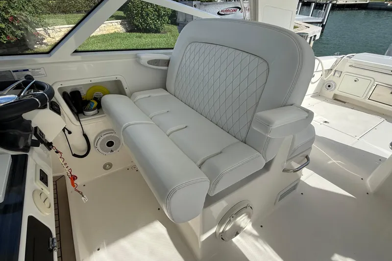 Slide: The Image of Luxurious seating on 2021 World Cat 400 DC-X boat, featuring white upholstery and diamond stitching. - 37