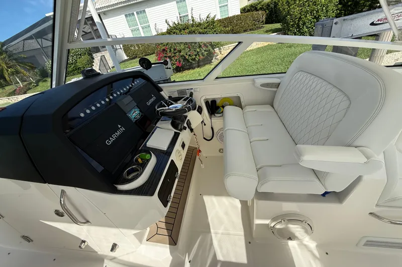 Slide: The Image of Interior of 2021 World Cat 400 DC-X boat with Garmin navigation system. - 38