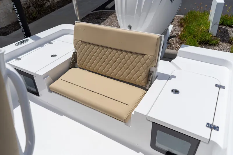 Slide: The Image of 2026 Sportsman Masters 247 Bay Boat with tan quilted seating and storage compartments. - 14