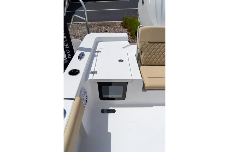Slide: The Image of 2026 Sportsman Masters 247 Bay Boat interior with seating and storage compartment. - 17