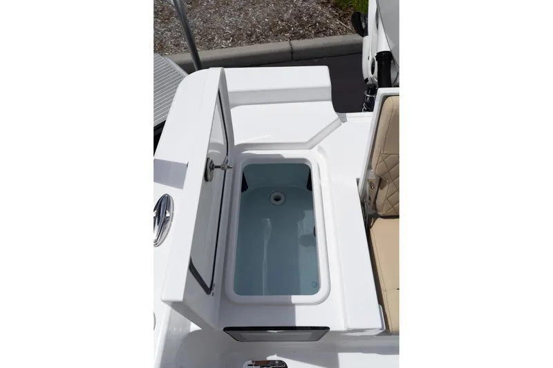 Slide: The Image of Livewell compartment on 2026 Sportsman Masters 247 Bay Boat, open lid view. - 18
