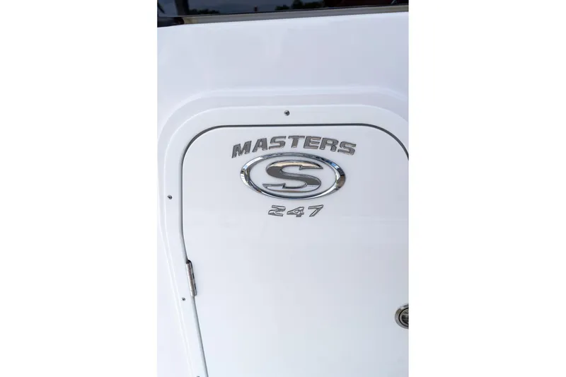 Slide: The Image of 2026 Sportsman Masters 247 Bay Boat logo on white surface. - 22