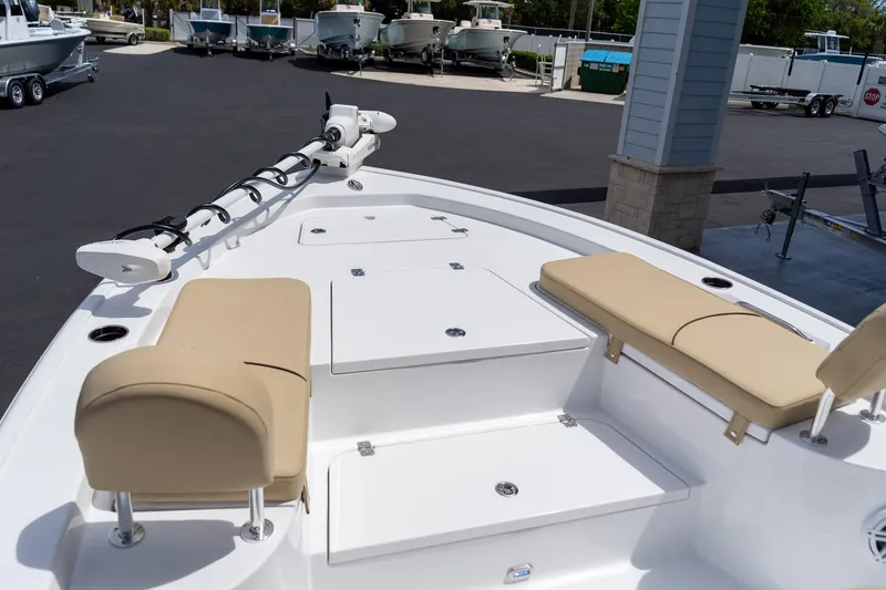 Slide: The Image of 2026 Sportsman Masters 247 Bay Boat with cushioned seating and storage compartments. - 24