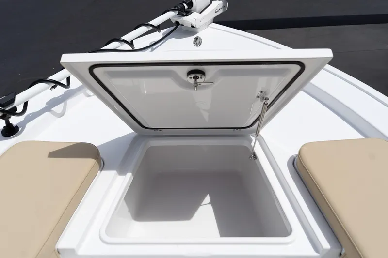 Slide: The Image of Open storage compartment on 2026 Sportsman Masters 247 Bay Boat, featuring beige seating. - 26