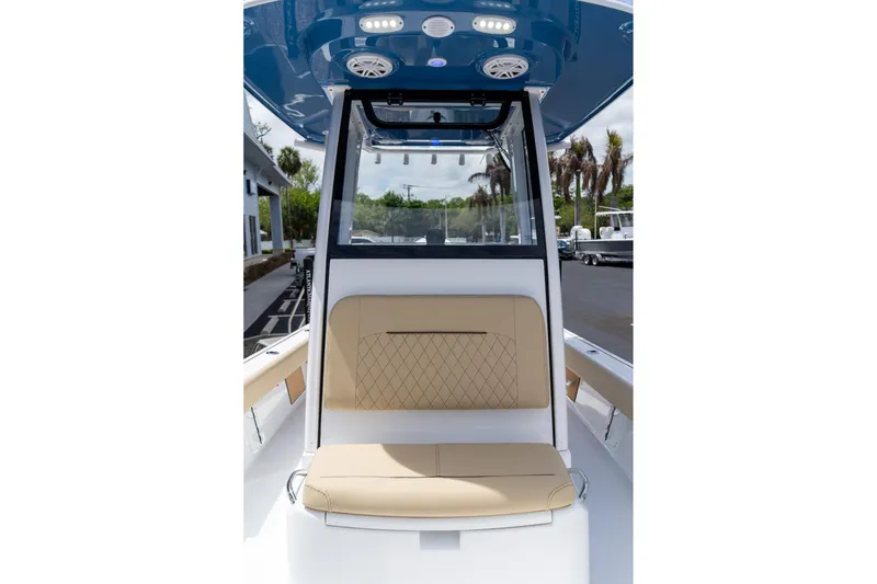 Slide: The Image of 2026 Sportsman Masters 247 Bay Boat interior with tan seating and modern design. - 28