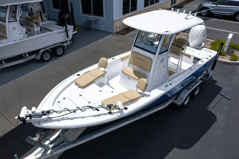 Slide: The Image of 2026 Sportsman Masters 247 Bay Boat on trailer, featuring sleek design and spacious seating. - 3