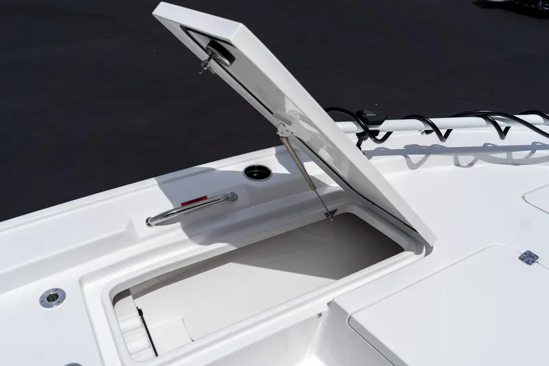 Slide: The Image of Open storage compartment on 2026 Sportsman Masters 247 Bay Boat deck. - 32