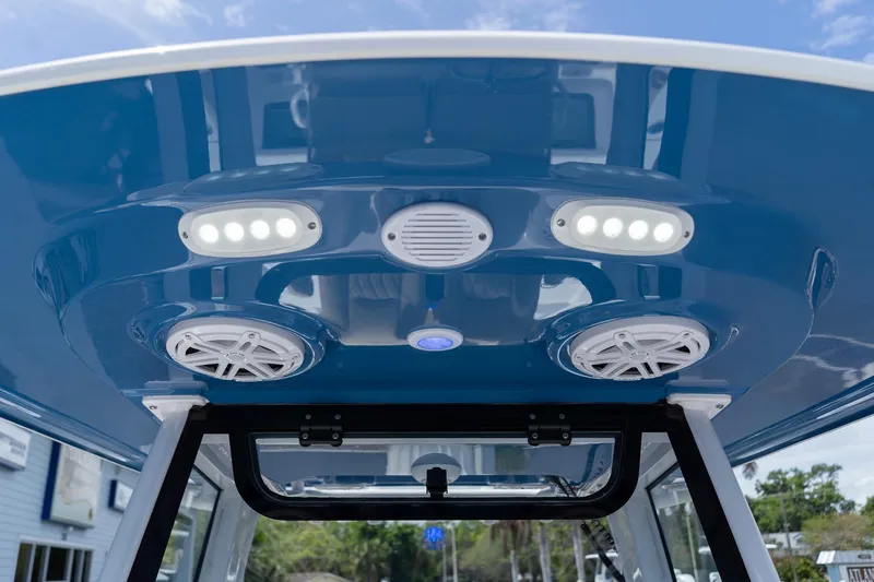 Slide: The Image of 2026 Sportsman Masters 247 Bay Boat T-top with integrated speakers and LED lights. - 34