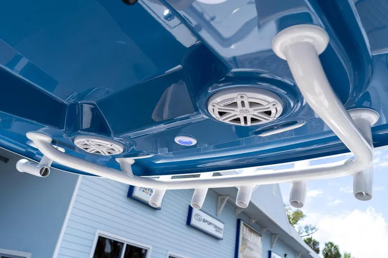 Slide: The Image of 2026 Sportsman Masters 247 Bay Boat with blue hull and rod holders. - 35