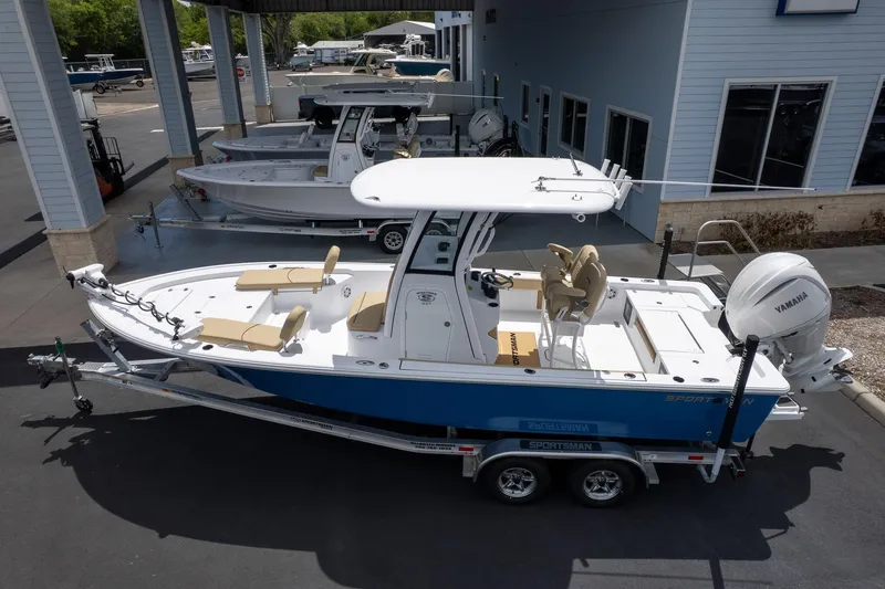 Slide: The Image of 2026 Sportsman Masters 247 Bay Boat on trailer, parked at dealership. - 5