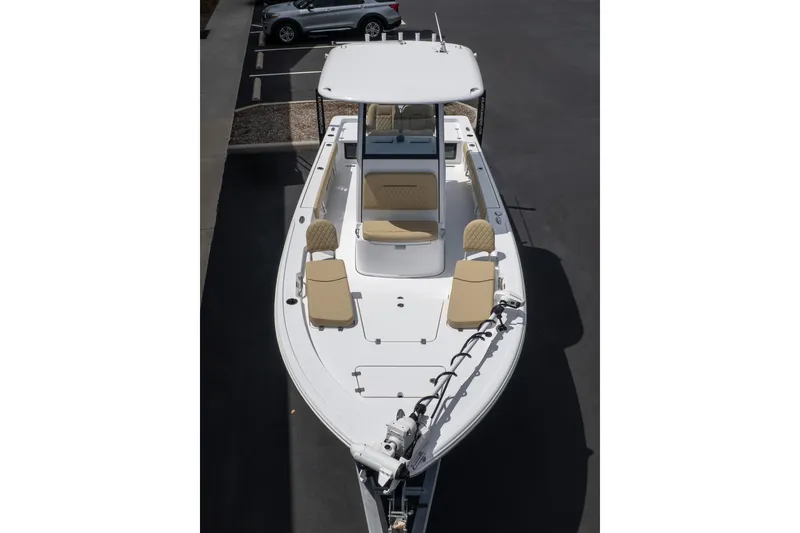Slide: The Image of 2026 Sportsman Masters 247 Bay Boat, aerial view, parked in a lot. - 7