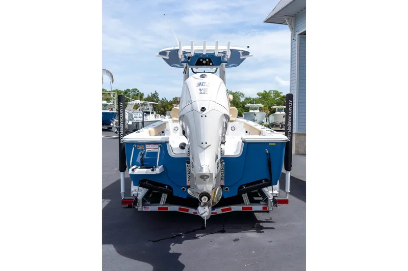 Slide: The Image of 2026 Sportsman Masters 247 Bay Boat with Suzuki engine, parked on a trailer. - 9