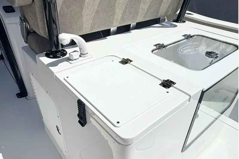 Slide: The Image of 2026 Sea Hunt Gamefish 30 Forward Seating boat interior with storage compartments and seating. - 10