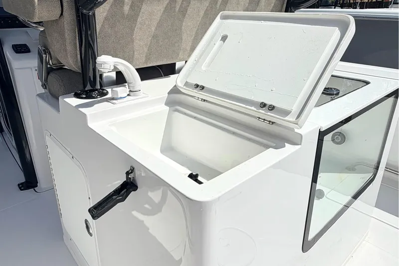 Slide: The Image of Open storage compartment on 2026 Sea Hunt Gamefish 30 Forward Seating boat. - 11