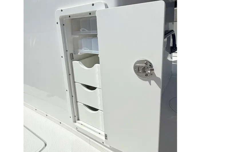 Slide: The Image of Storage compartment on 2026 Sea Hunt Gamefish 30 Forward Seating boat. - 12