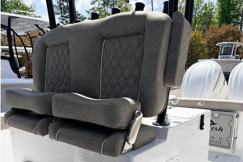 Slide: The Image of 2026 Sea Hunt Gamefish 30 boat with plush forward seating and dual outboard engines. - 14