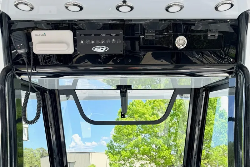 Slide: The Image of 2026 Sea Hunt Gamefish 30 Forward Seating dashboard with Garmin electronics and control panel. - 16