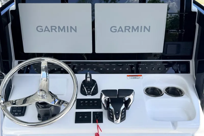 Slide: The Image of 2026 Sea Hunt Gamefish 30 helm with Garmin displays and modern controls. - 17