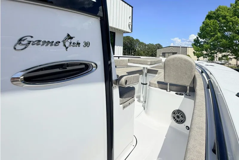 Slide: The Image of 2026 Sea Hunt Gamefish 30 Forward Seating boat, featuring sleek design and comfortable seating. - 18