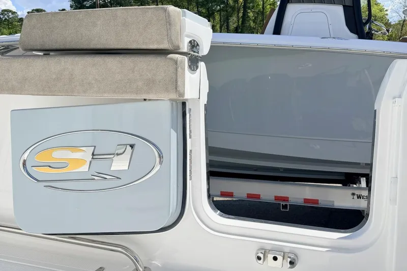 Slide: The Image of 2026 Sea Hunt Gamefish 30 boat with open hatch and logo detail. - 2