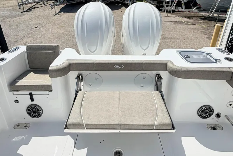 Slide: The Image of 2026 Sea Hunt Gamefish 30 Forward Seating boat interior with dual engines and cushioned seating. - 5