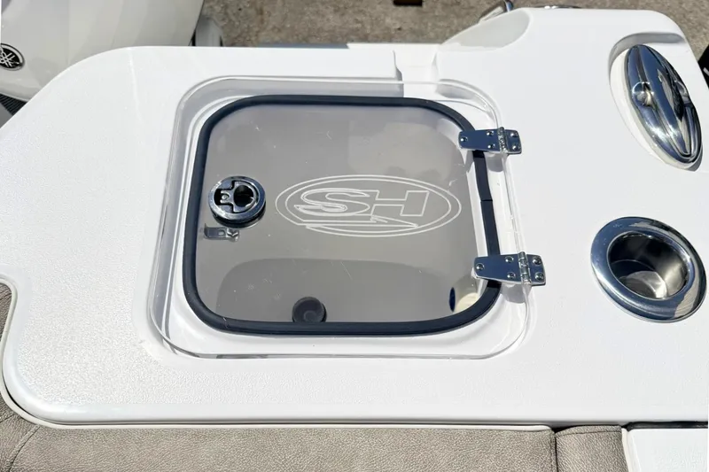 Slide: The Image of 2026 Sea Hunt Gamefish 30 Forward Seating boat hatch with logo and cup holders. - 6