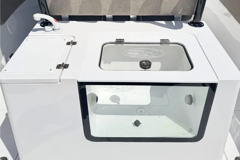 Slide: The Image of 2026 Sea Hunt Gamefish 30 Forward Seating livewell and storage compartment. - 9